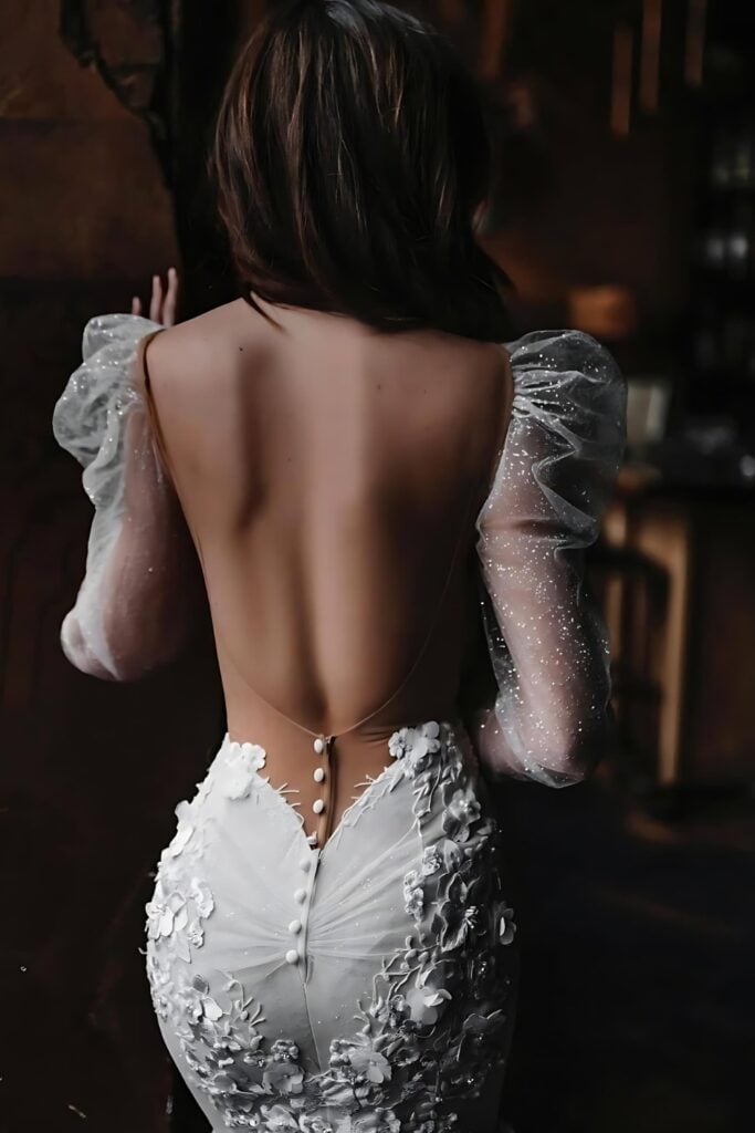 wedding gown with a backless dramatic back, and a cathedral train