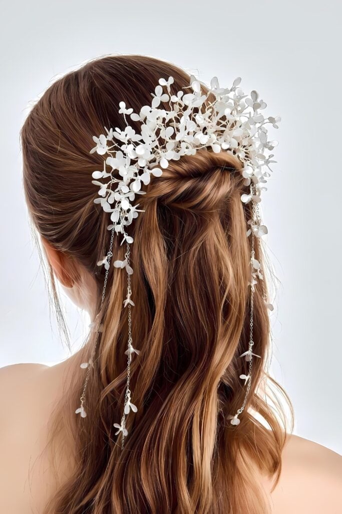 A floral wedding headpiece cascading down the back