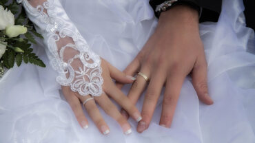 Married Couple Wearing Wedding Rings