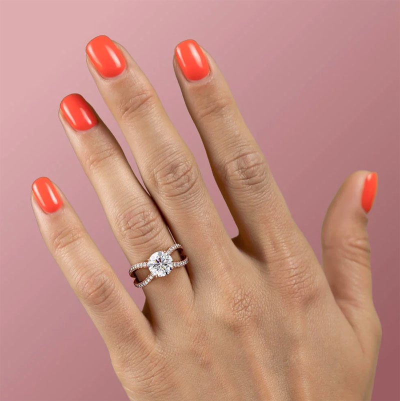 moissanite engagement ring on hand