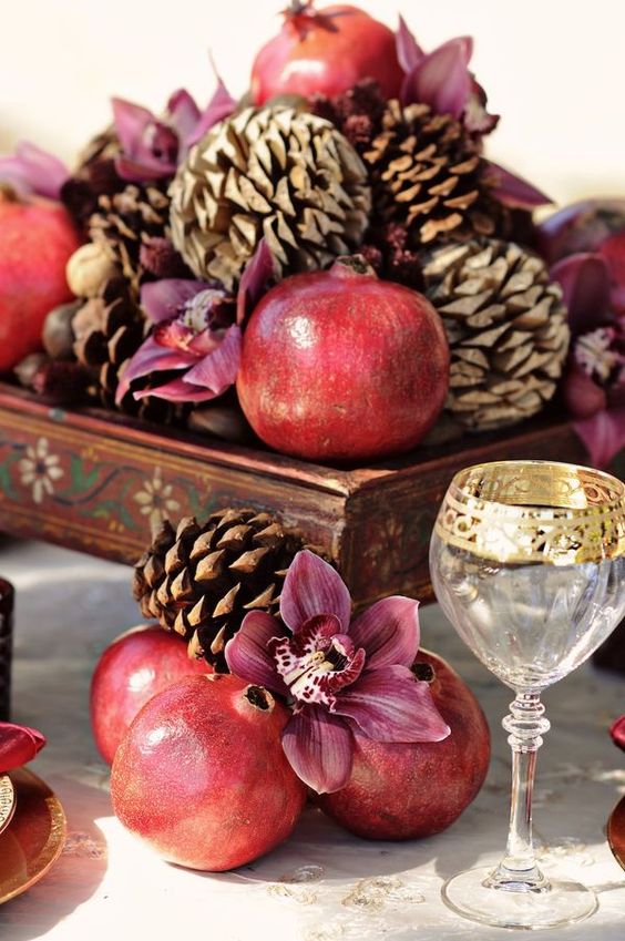fall wedding centerpiece pomegranate and pine cone